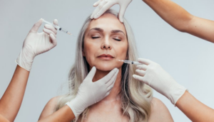 Woman receiving BOTOX from two dentists